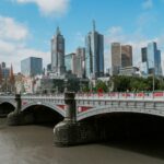 white bridge across city buildings